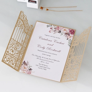 Macro detail of laser-cut gate design with elegant floral print wedding invitation