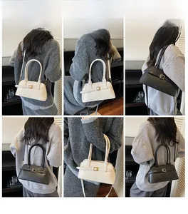 Detailed views of women's minimalist shoulder bag in black and cream featuring dual straps