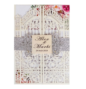Detail of laser-cut ivory wedding invitation with silver glitter band and pink floral motif