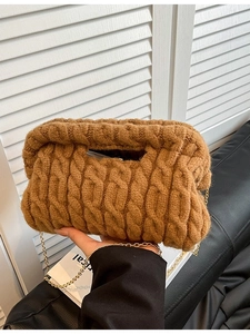 Caramel knit crossbody bag with chunky cable texture and gold metal chain strap