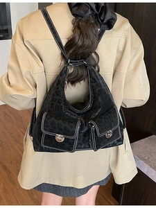 Retro black leopard print tote bag with white contrast stitching and double front pockets