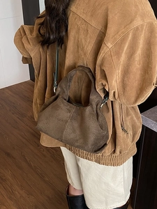 Vintage dark brown suede bucket bag with pleated texture and stylish shoulder strap