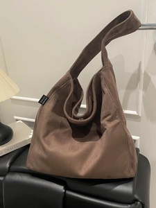 Brown suede tote bag with large capacity and soft slouchy design for British style