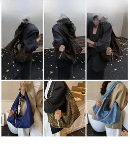 Model wearing large hobo tote bags with leopard prints and denim textures including plush charms