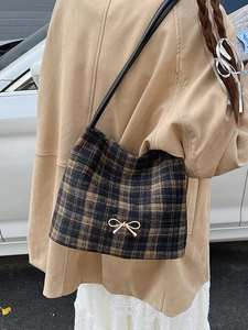 Chic retro plaid bucket bag with a golden bow and slim leather strap for women