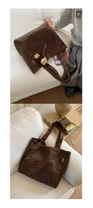 Detail view of leopard print canvas tote bag with shoulder straps and plush bear charm