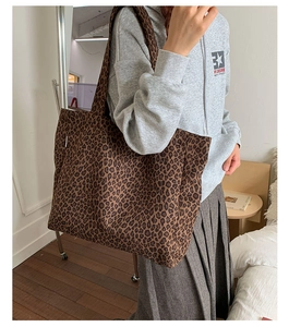 Detail of large leopard print canvas tote bag showing interior capacity and soft fabric