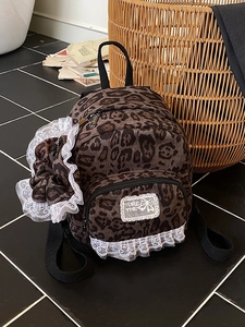 Vintage leopard print mini backpack for women with white lace trim and bow charm