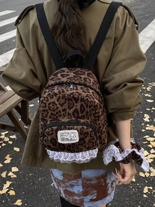 Leopard print mini backpack with lace trim and matching scrunchie for women's casual style