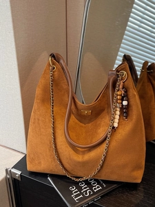Retro brown suede hobo bag with vintage metal chain strap and decorative wooden beads