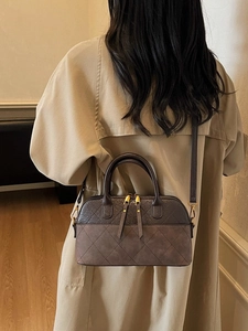 Retro diamond-quilted dark brown shell handbag with dual zippers and adjustable strap
