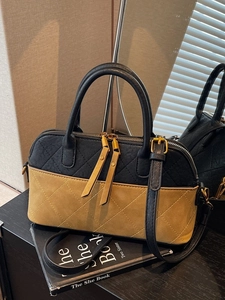 Vintage quilted shell bag in black and yellow suede with top handle and strap