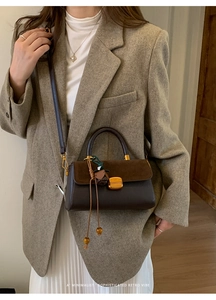 Retro contrast leather crossbody bag with flower tassel detail on wool blazer