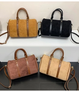 Macro view of matte Boston bags in four colors with smooth straps and gold hardware