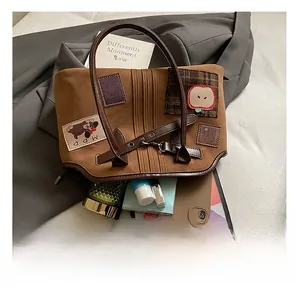 Interior capacity view of canvas tote bag with embroidered apple and bear patterns