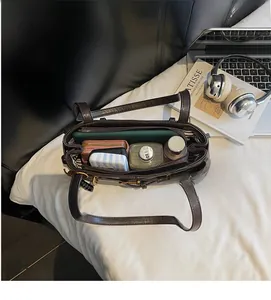 Top view of coffee retro shoulder bag showing large capacity with internal striped lining