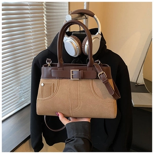Detail view of a vintage frosted Boston bag featuring leather trim and strap