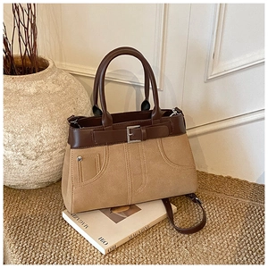 Retro contrast handbag featuring khaki suede, dark brown leather, and dual cylinder handles