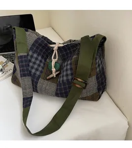 Detail of checkered patchwork tote bag with adjustable strap and toggle button closure