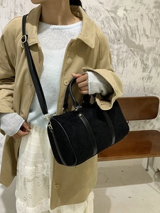 Retro black matte suede Boston bag with leather handles and gold hardware detailing