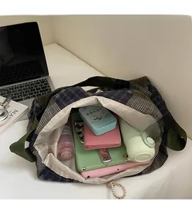 Top-down view of spacious plaid tote bag showcasing large capacity for daily items