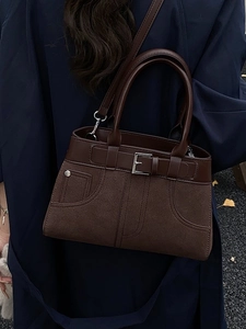 Retro dark brown suede crossbody bag with decorative belt buckle and top handle strap