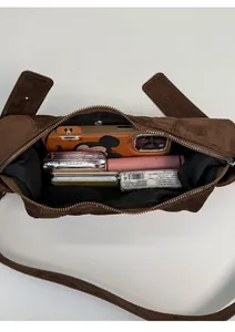 Top view of brown suede crossbody bag showing large storage capacity for essentials