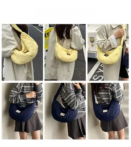 Quilted heart pattern half-moon shoulder bag shown in multiple fashion angles on model