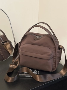 Deep brown nylon crossbody bag with multi-pocket design and wide shoulder strap