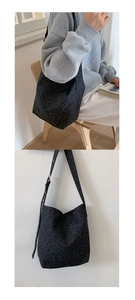 Detail of black leopard print canvas tote bag with adjustable strap and large capacity