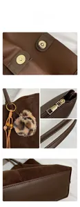 Close-up of brown tote bag with gold magnetic buckle and leopard print charm detail