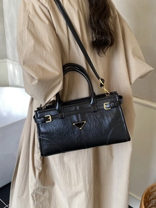 Vintage black wrinkled leather tote bag with gold hardware and removable shoulder strap