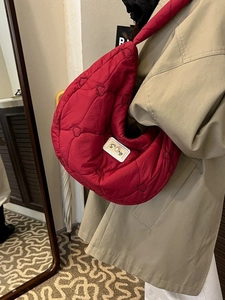 Deep red heart-quilted crescent shoulder bag made of lightweight nylon fabric