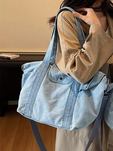 Light blue denim tote bag with adjustable shoulder strap and large capacity