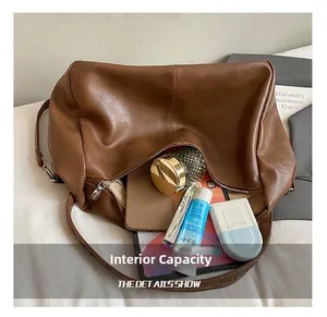 Detailed interior view of a large brown leather tote showing spacious storage capacity