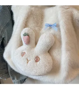 Close-up of white plush bunny tote bag with cute carrot clip and blue plaid bow detail