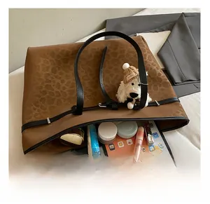 Interior view showing the large capacity and leopard print detail of the vintage tote bag