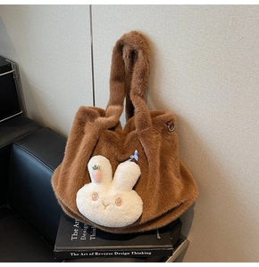 Detail of soft brown faux fur tote bag featuring a cute white 3D bunny and embroidery