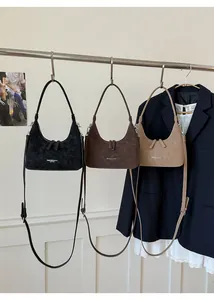 Three minimalist underarm bags in black, dark brown, and beige PU leather texture