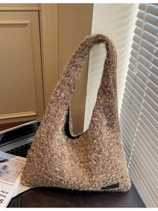 Brown fuzzy faux shearling hobo bag with chain strap and soft plush texture