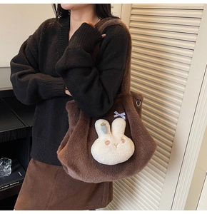 Detail of soft brown faux fur tote bag featuring 3D cartoon bunny and plaid bow