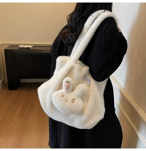 Detailed texture of white plush tote bag with 3D bunny ears and blue checkered bow