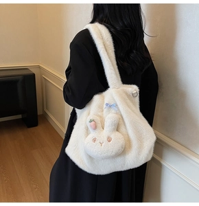 Detail of white faux fur tote bag with cute 3D bunny head and plaid bow accent