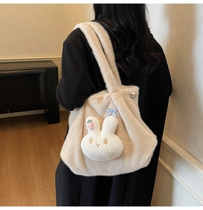 Detail of plush beige tote bag with a cute 3D bunny head and soft faux fur texture