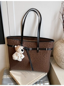Large vintage brown leopard print tote bag with black straps and bear charm detail