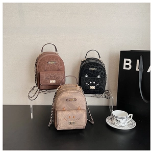 Three colors of mini cat-shaped backpacks with leopard print details and metal chain straps