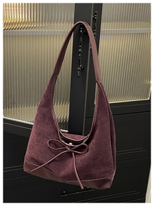 Close-up of vintage dark burgundy hobo bag showing suede and leather contrast texture