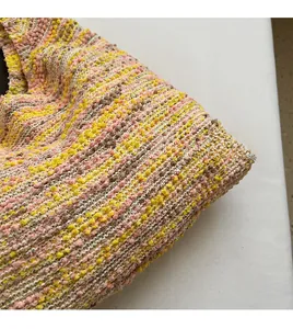 Detailed macro view of the colorful knit tote bag showing soft textured woven fabric
