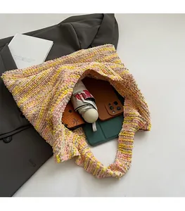 Interior view of spacious color-block knit tote bag showing ample storage for essentials