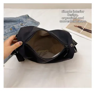 Detail view of black waterproof nylon bag interior with simple spacious compartment